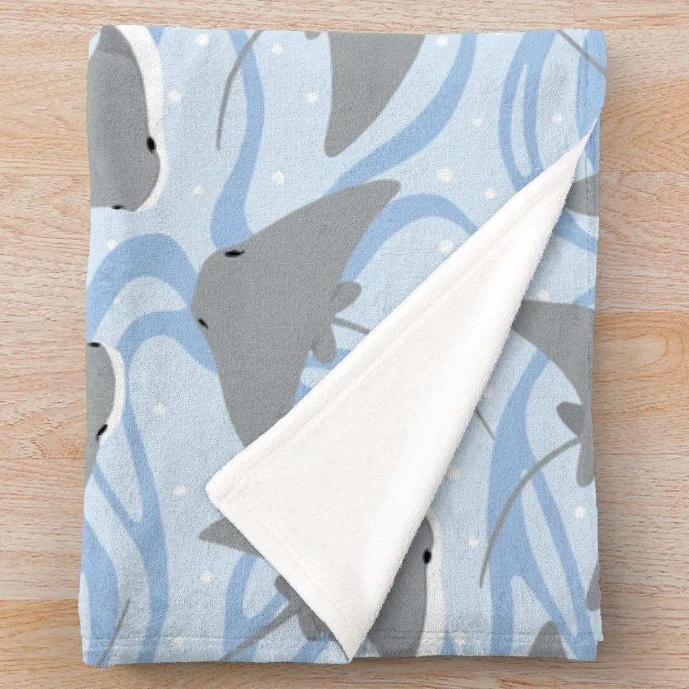 Plush blanket featuring cownose rays and stingrays, perfect for ocean and marine life enthusiasts