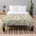 Plush blanket featuring a detailed collage of Australian flora and fauna
