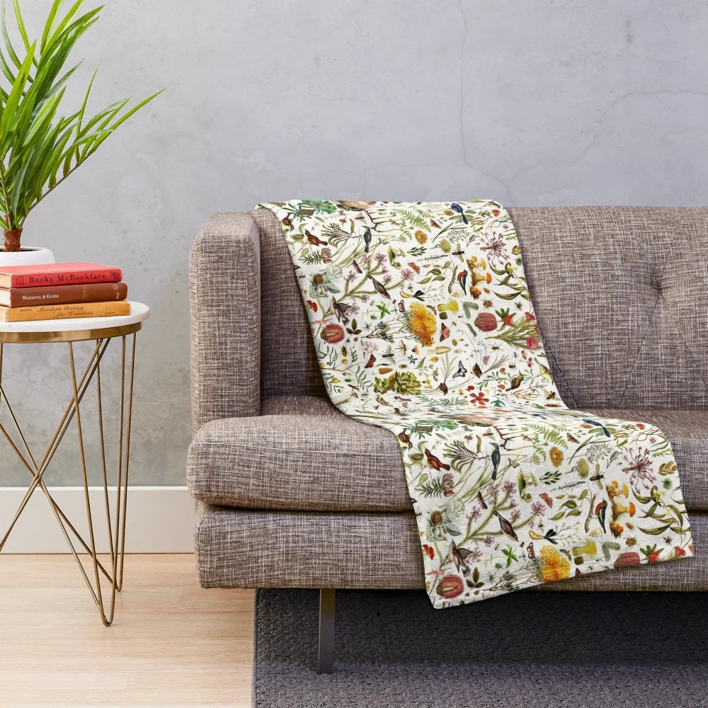 Plush blanket featuring a detailed collage of Australian flora and fauna