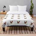 Plush blanket featuring a colorful, abstract design of a legendary hawk
