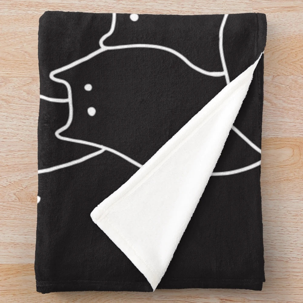 Plush blanket with a design of lots of whimsical black and white cats