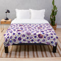 Plush blanket featuring a pattern of microscopic white blood cells