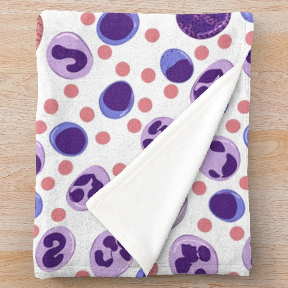 Plush blanket featuring a pattern of microscopic white blood cells