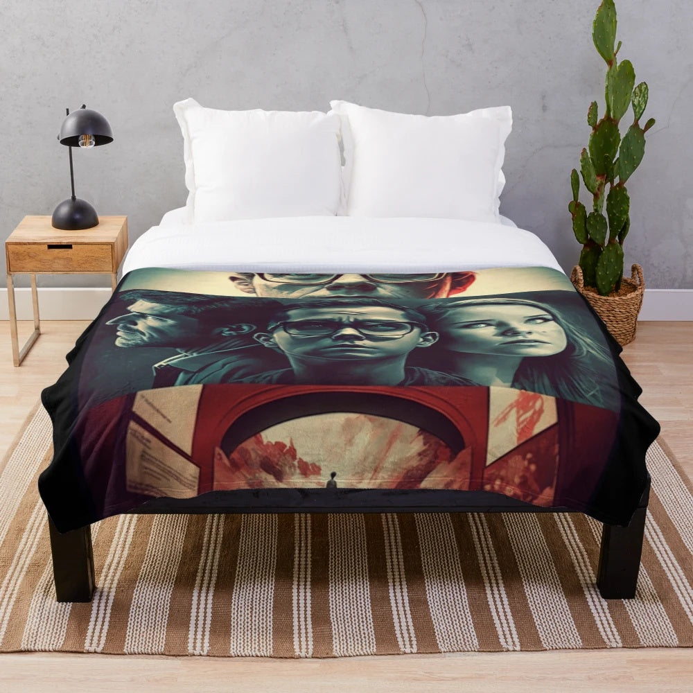 Plush blanket with a movie-inspired design, featuring a film reel and cinematic elements.