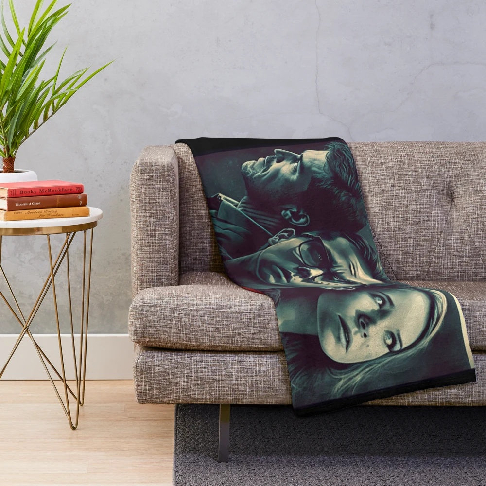 Plush blanket with a movie-inspired design, featuring a film reel and cinematic elements.