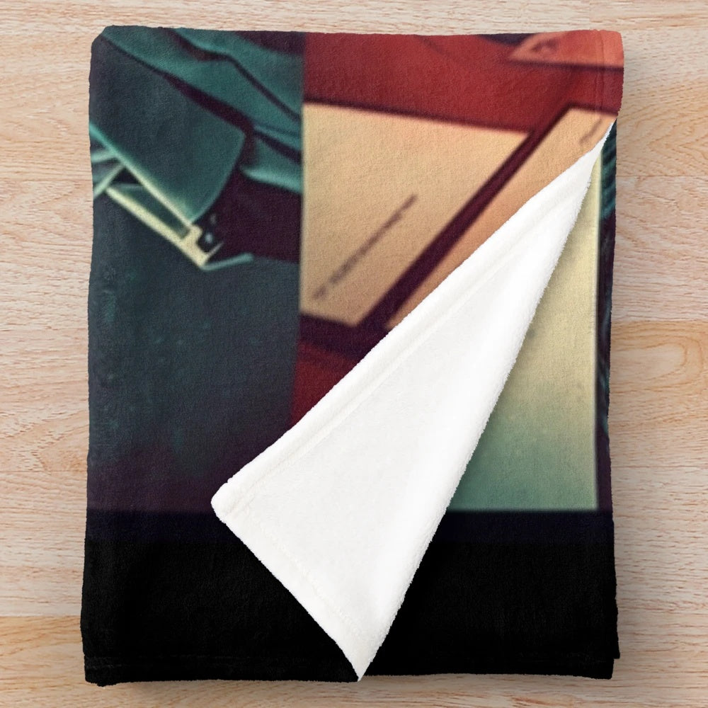 Plush blanket with a movie-inspired design, featuring a film reel and cinematic elements.