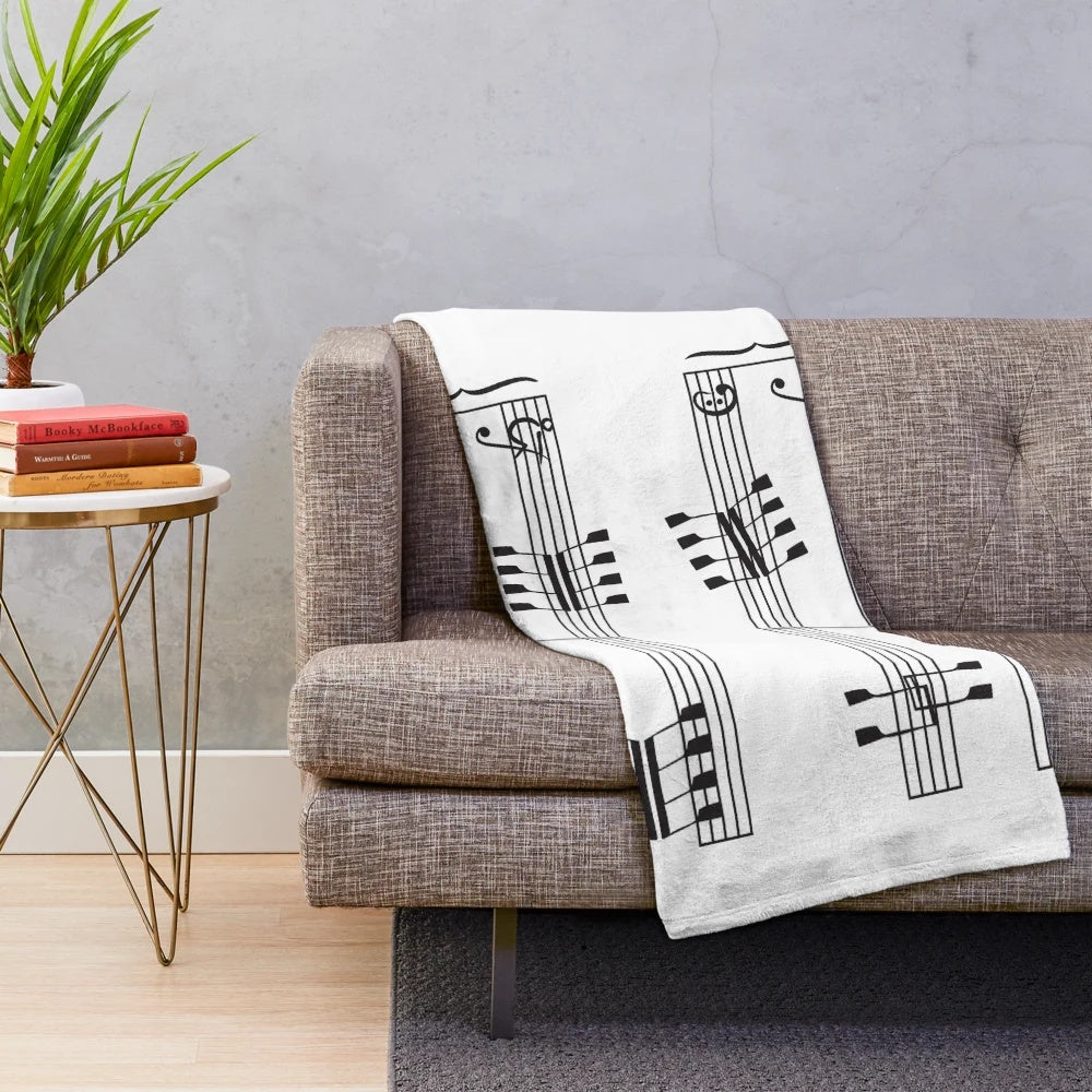 Plush blanket featuring musical notes design for rowing enthusiasts