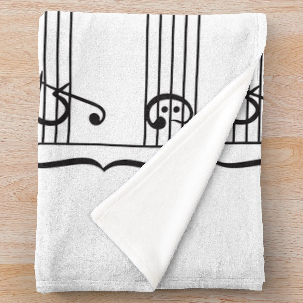 Plush blanket featuring musical notes design for rowing enthusiasts