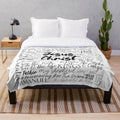 Plush blanket featuring the names of God in Christian inspired calligraphy and typography