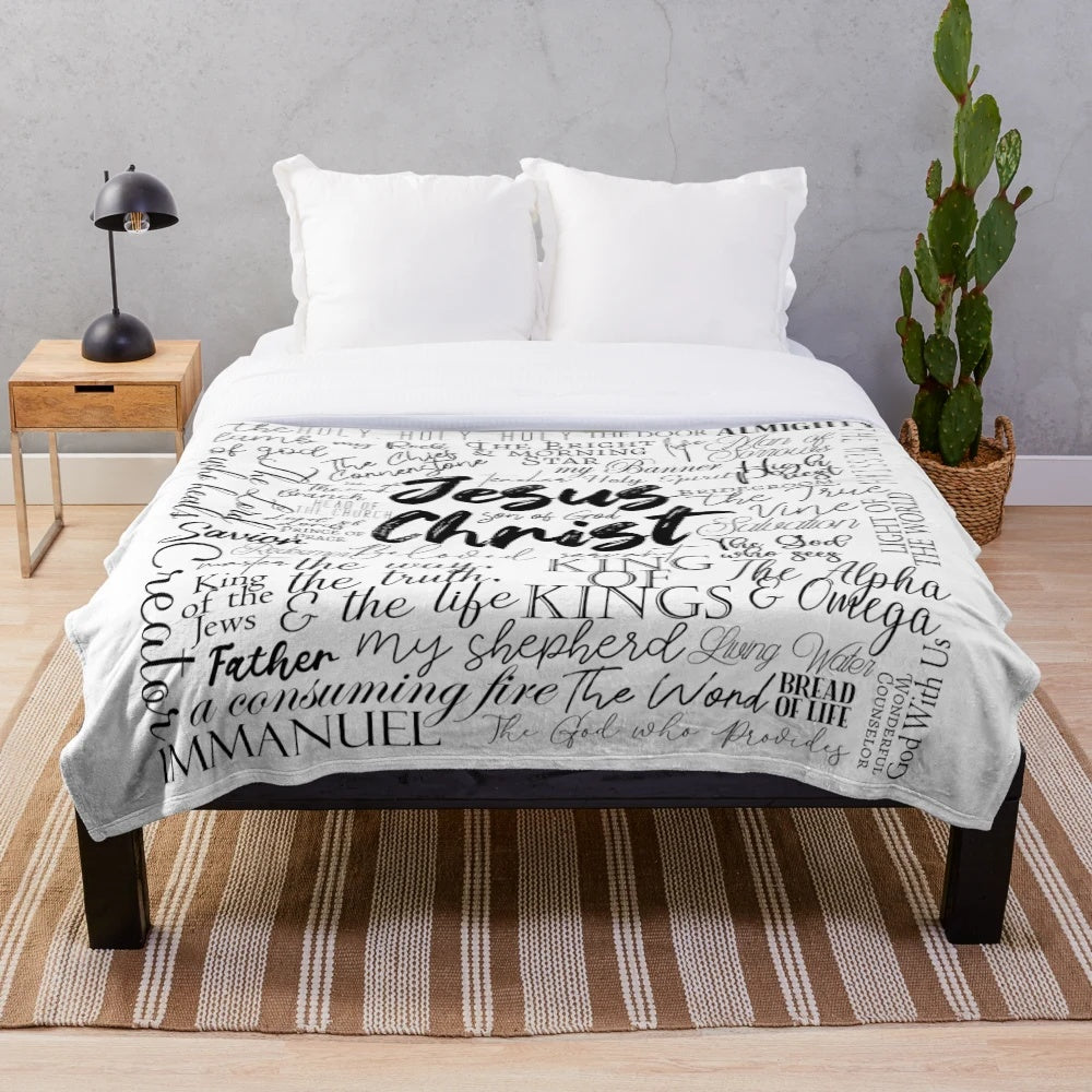 Plush blanket featuring the names of God in Christian inspired calligraphy and typography
