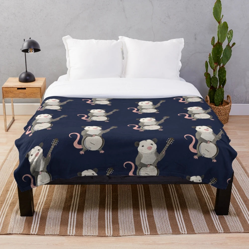 Plush blanket featuring a possum playing the banjo instrument