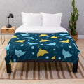 Plush blanket with a detailed stingray pattern on a dark blue background