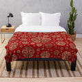 Plush blanket featuring a traditional Chinese double happiness symbol pattern in gold on a red background