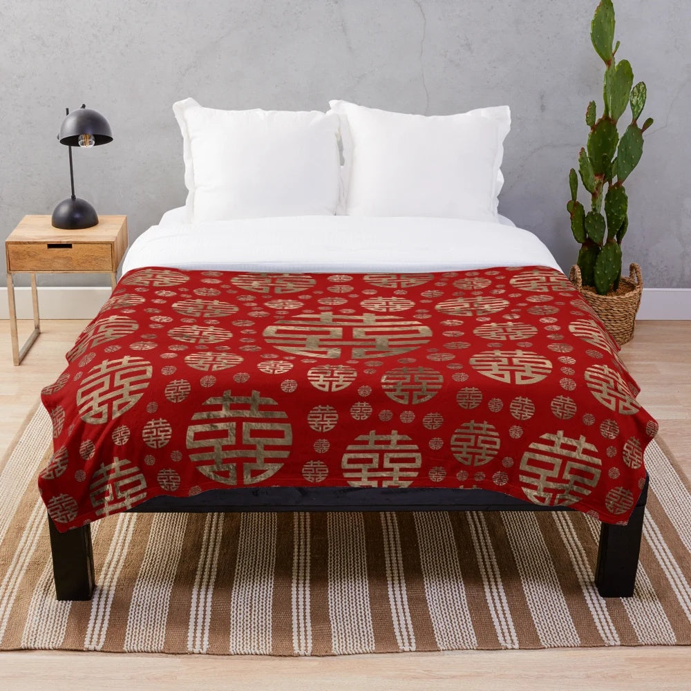 Plush blanket featuring a traditional Chinese double happiness symbol pattern in gold on a red background