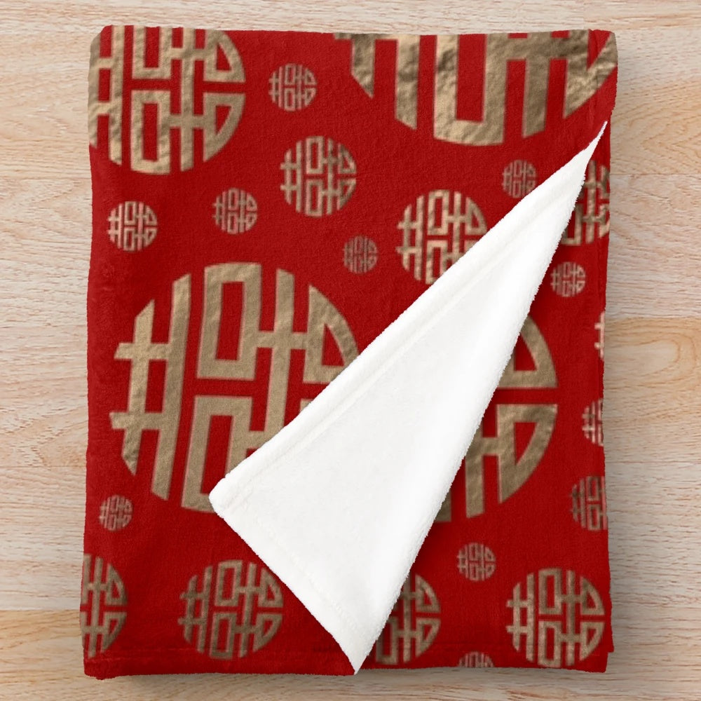 Plush blanket featuring a traditional Chinese double happiness symbol pattern in gold on a red background