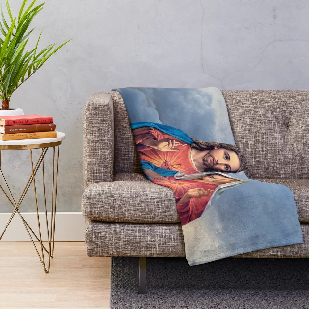 Plush blanket featuring detailed artwork of the twin hearts of Jesus and Mary against a sky background