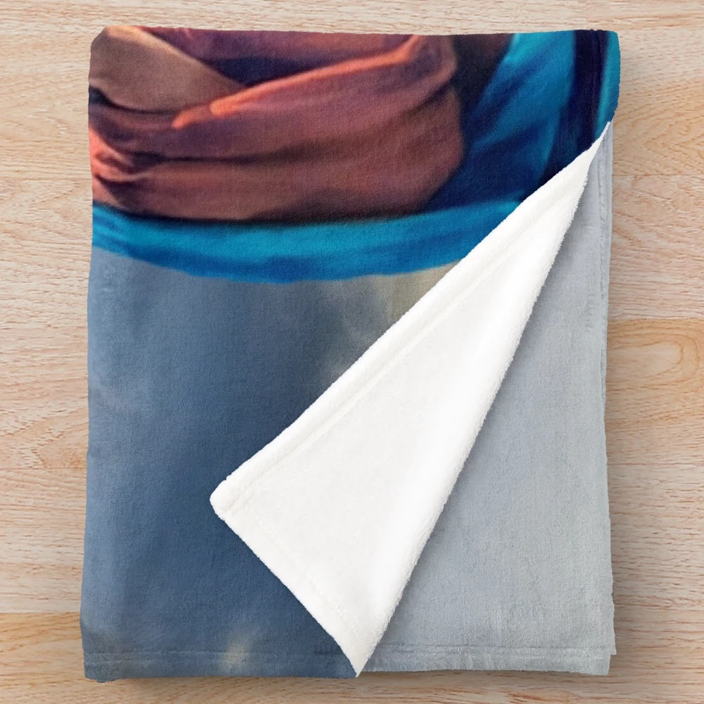 Plush blanket featuring detailed artwork of the twin hearts of Jesus and Mary against a sky background