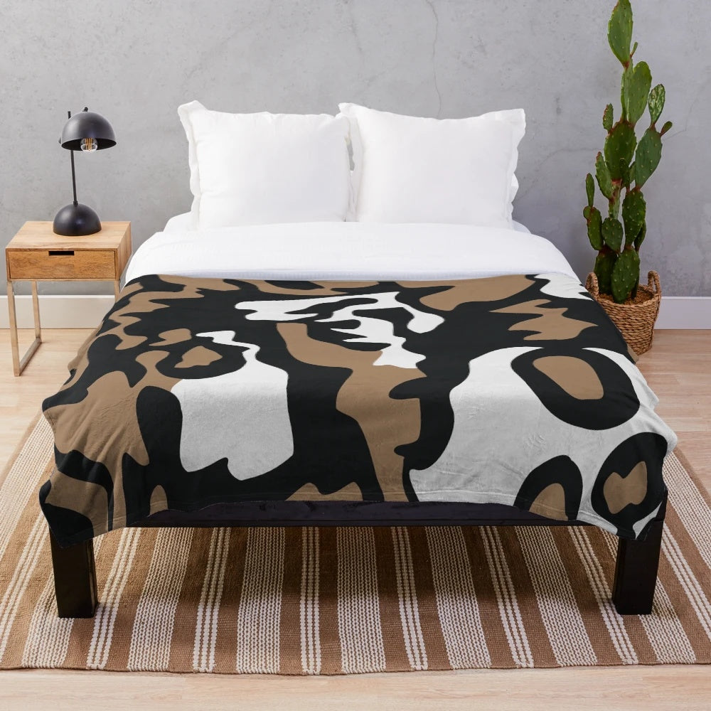 Cozy plush blanket featuring a vibrant pattern of the critically endangered African wild dog