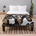 Cozy plush blanket featuring a vibrant pattern of the critically endangered African wild dog