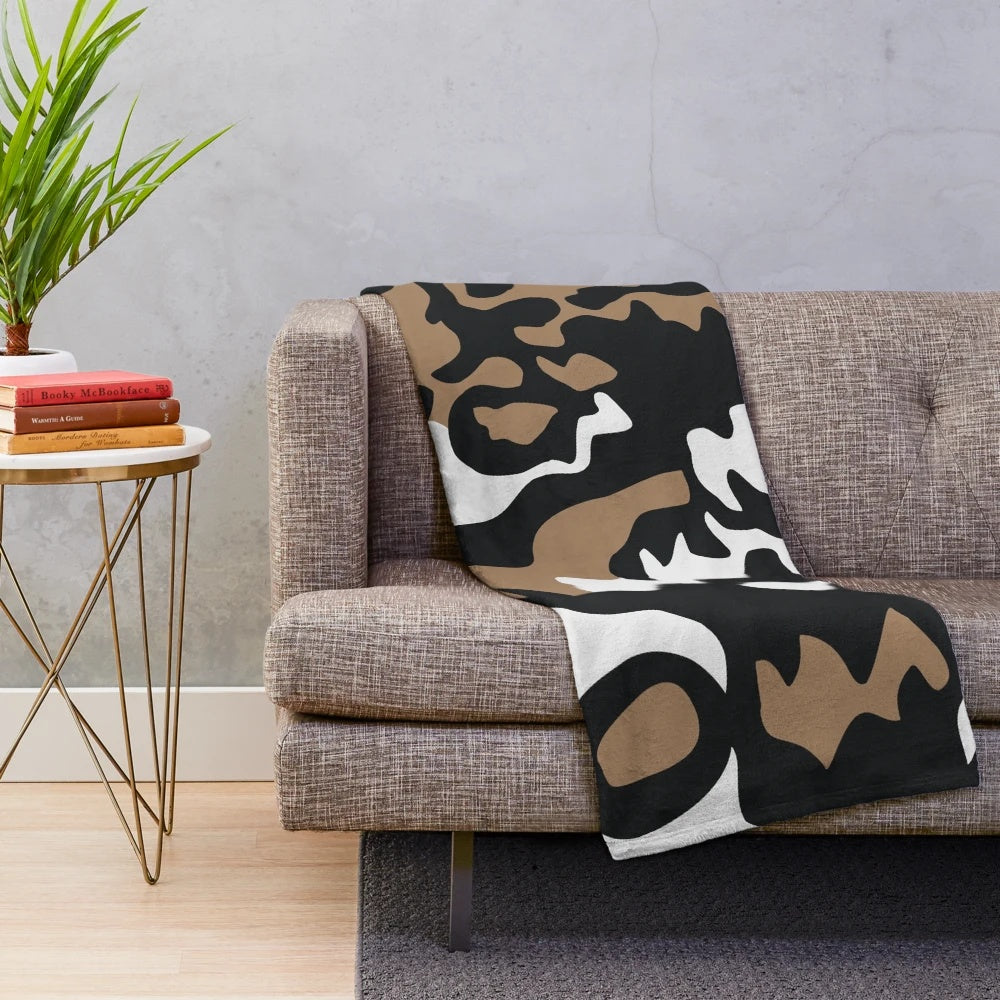 Cozy plush blanket featuring a vibrant pattern of the critically endangered African wild dog