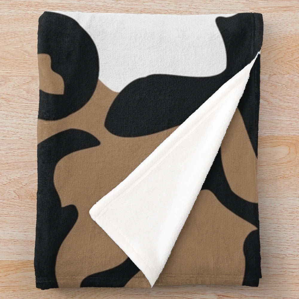 Cozy plush blanket featuring a vibrant pattern of the critically endangered African wild dog