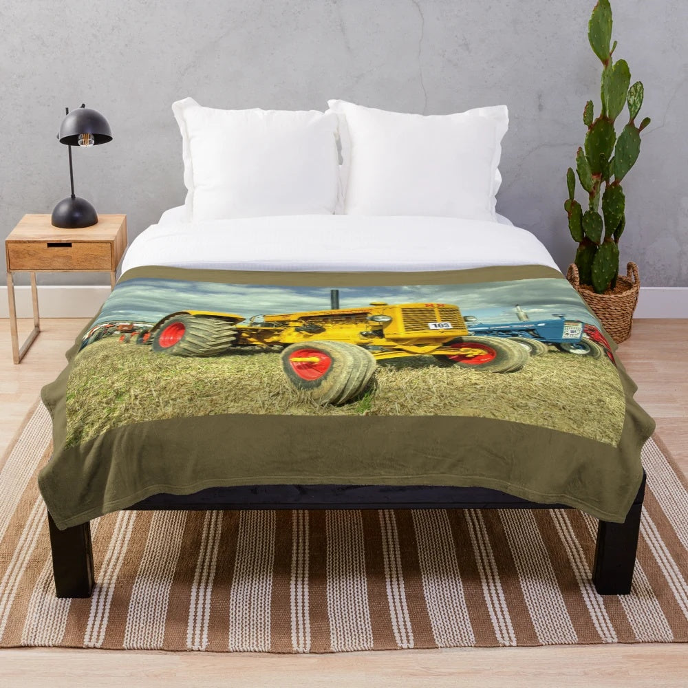 Plush blanket with vintage Minneapolis Moline G tractor design
