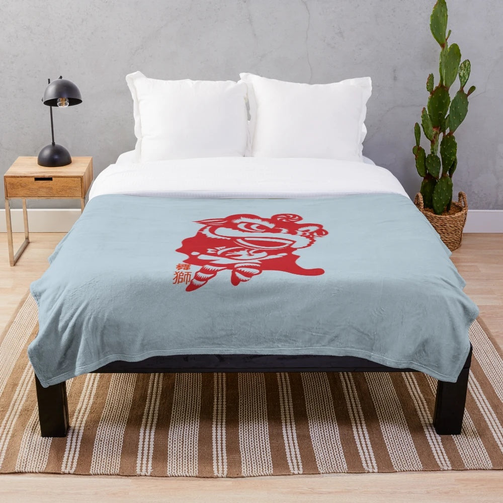 Plush Chinese lion dancing on a blue blanket
