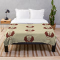 Plush blanket with a crest design inspired by the video game Castlevania
