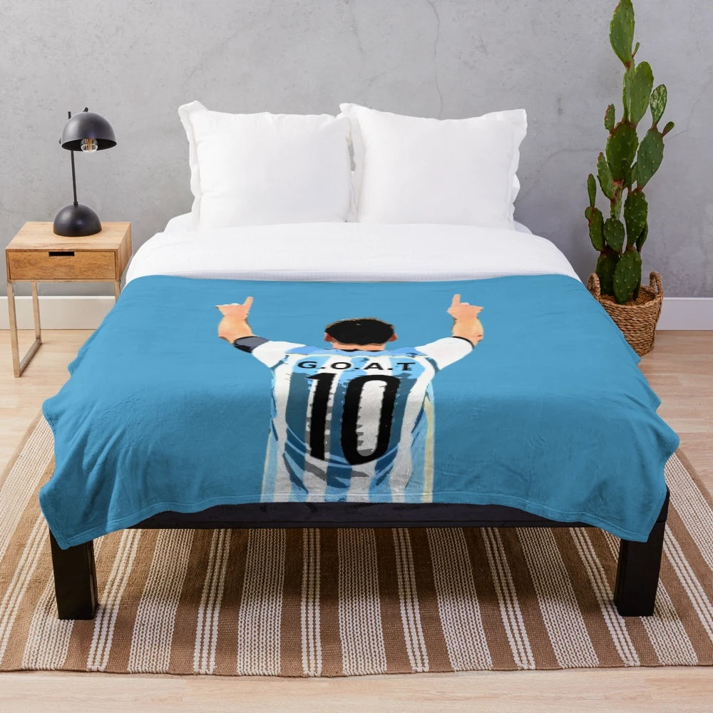 Plush football blanket with GOAT (greatest of all time) design