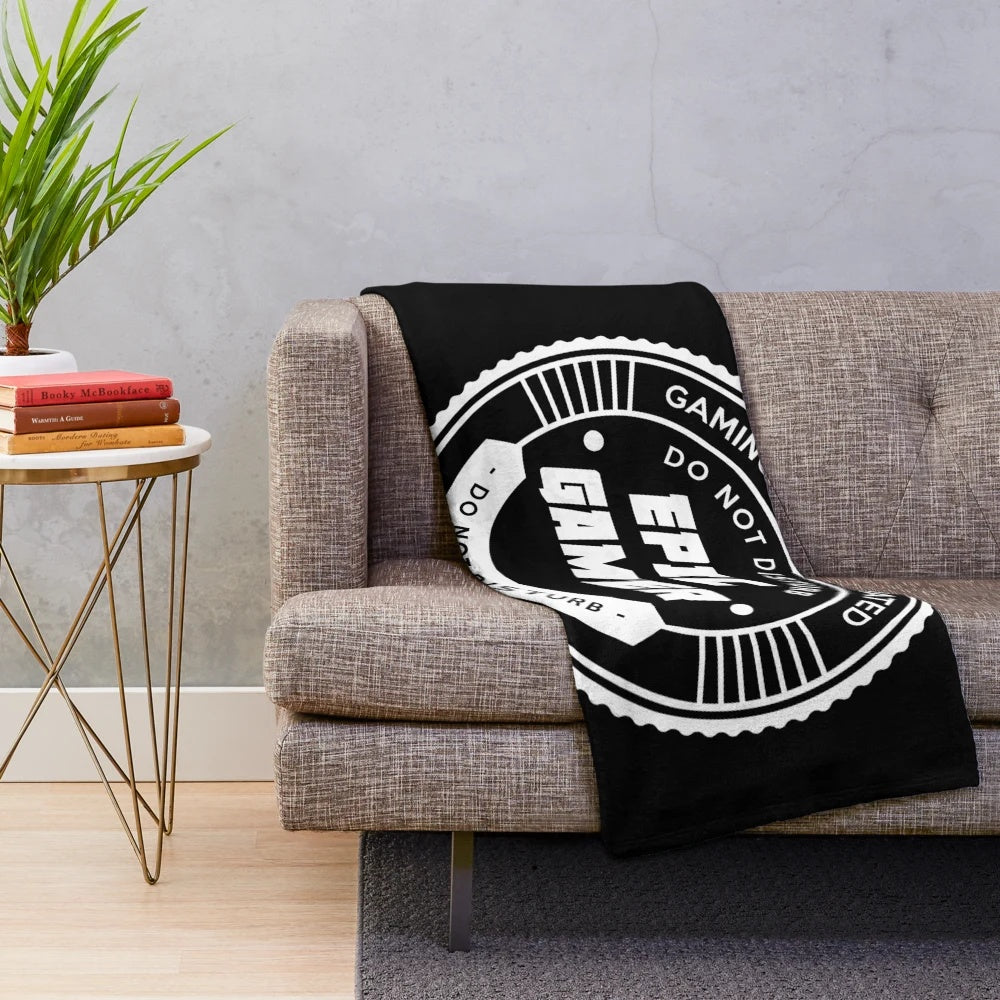 Plush gaming blanket with retro video game controller and pixel art design
