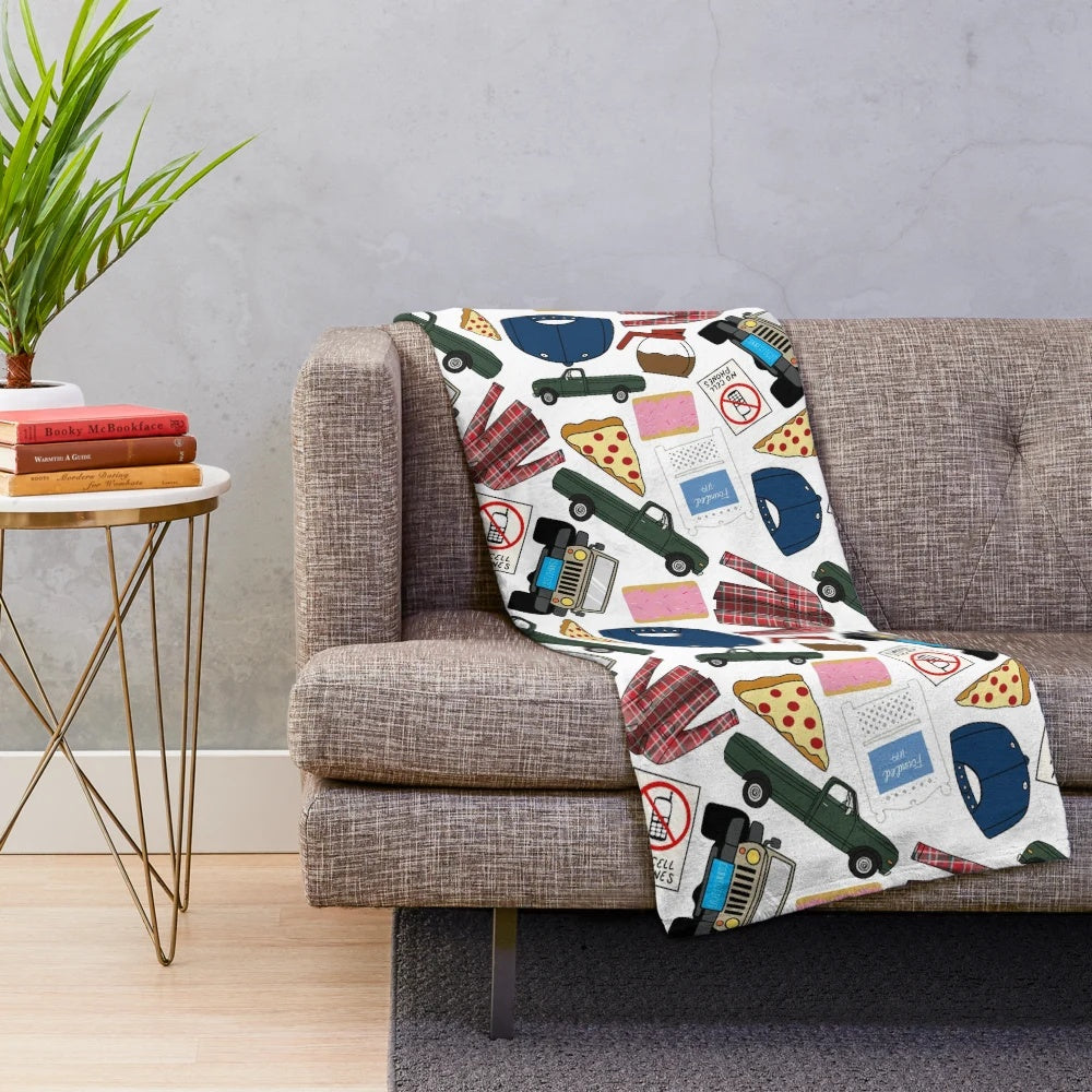 Plush white blanket with Gilmore Girls themed patterns and icons