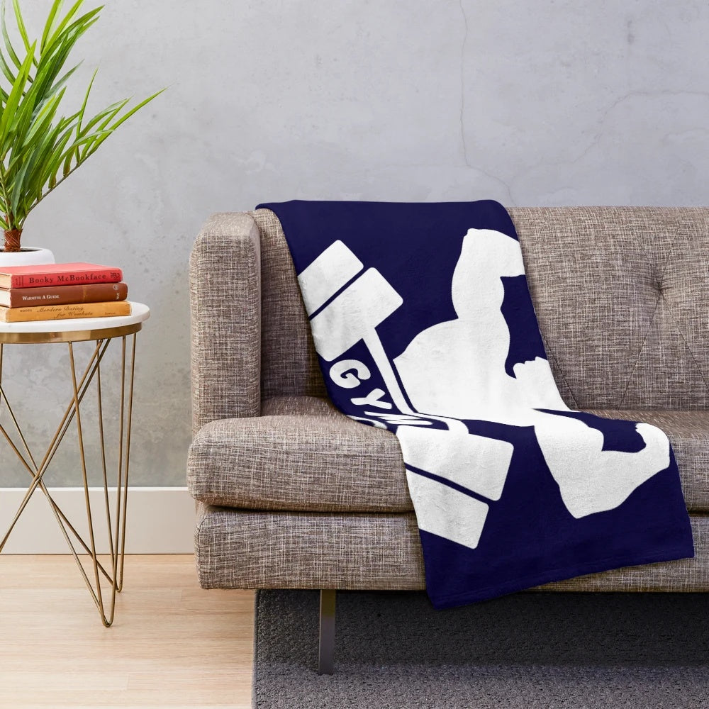 Plush blanket featuring gym-related imagery and text