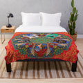 Plush mandala-inspired blanket featuring Kanye West's "My Beautiful Dark Twisted Fantasy" design