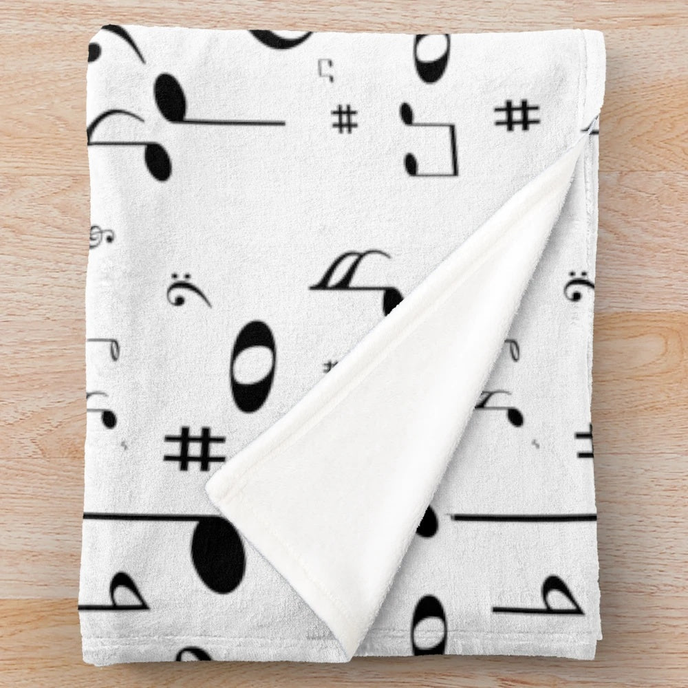Plush black and white music notes blanket