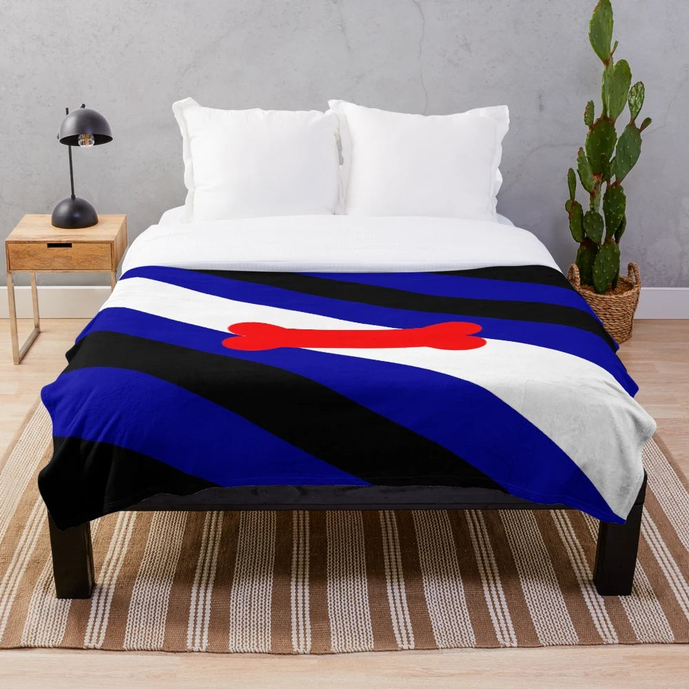 Plush puppy play pride flag blanket in blue, black, red, and white with bone design