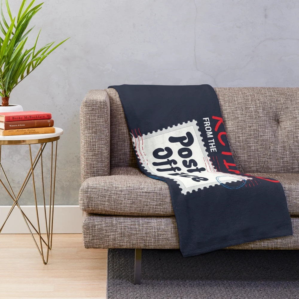 Plush blanket featuring a retired postal worker design