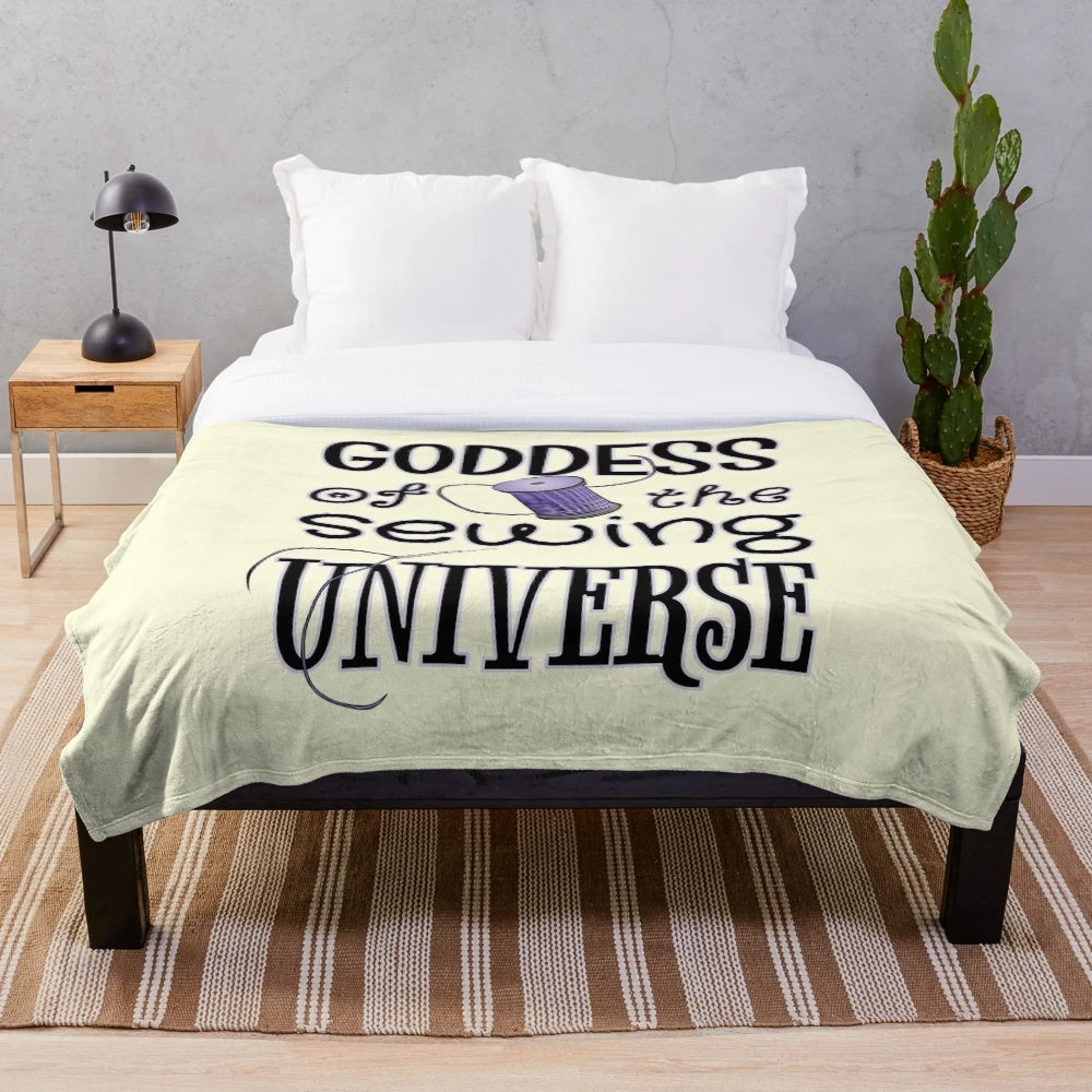 Plush sewing-themed blanket with a goddess of the sewing universe design