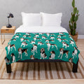 Treeing Walker Coonhound on a teal plush blanket