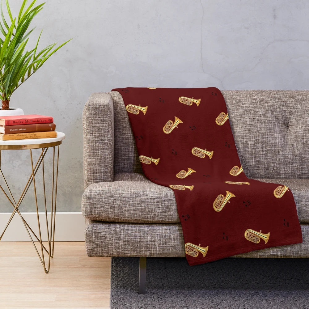 Cozy plush blanket with a tuba pattern design, perfect for music lovers
