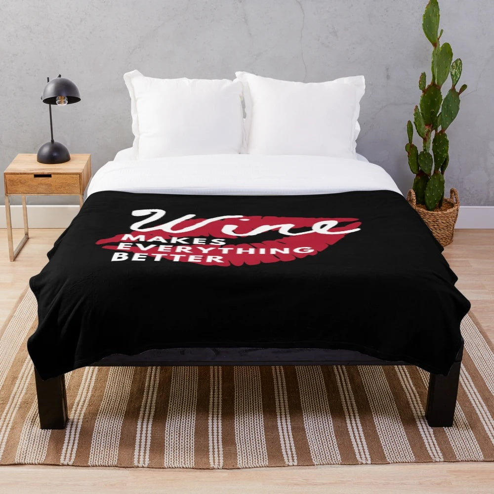 Cozy plush blanket with "Wine makes everything better" design for wine enthusiasts