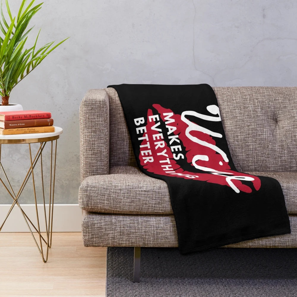 Cozy plush blanket with "Wine makes everything better" design for wine enthusiasts