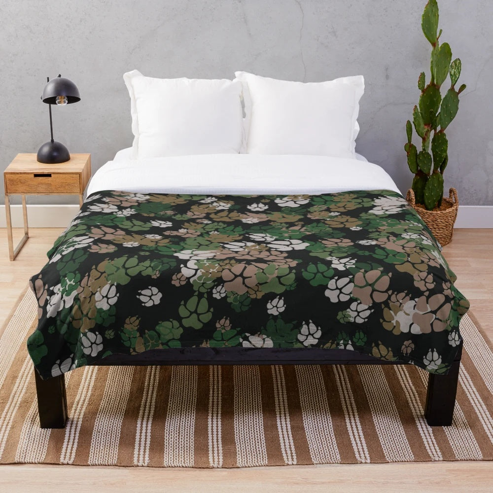 Camo plush blanket with woodland pattern and paw prints