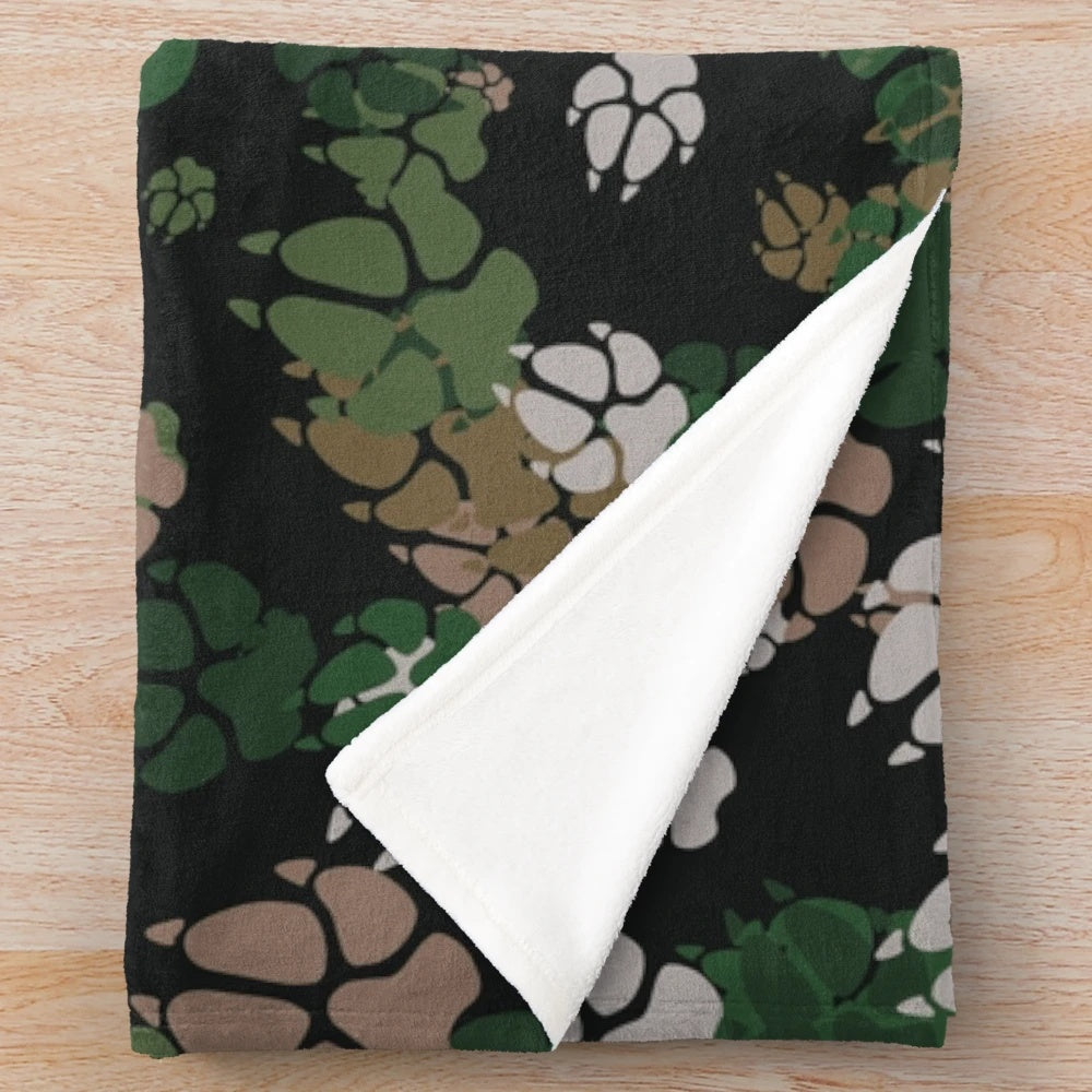 Camo plush blanket with woodland pattern and paw prints
