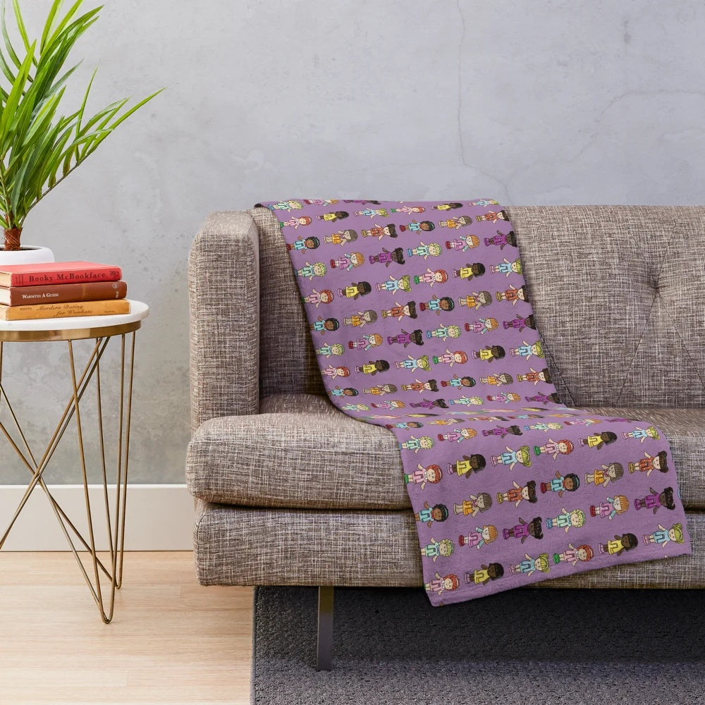 Polly Pocket plush blanket featuring a purple background and nostalgic 90s design