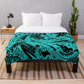Polynesian tribal teal plush blanket with tropical hibiscus designs