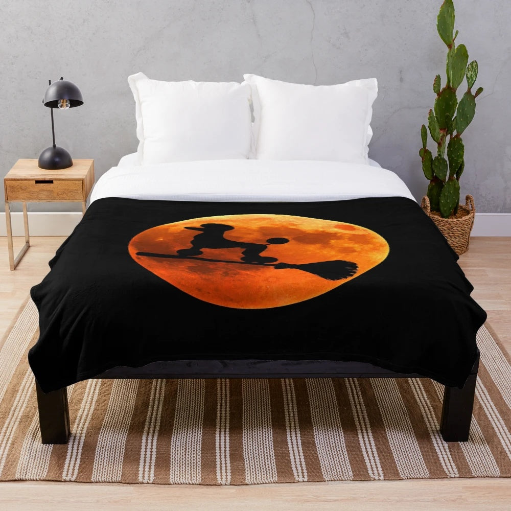 Poodle dog silhouette against the moon on a cozy plush blanket for Halloween
