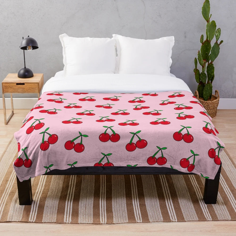 Colorful pop art inspired cherries pattern on a plush, cozy blanket