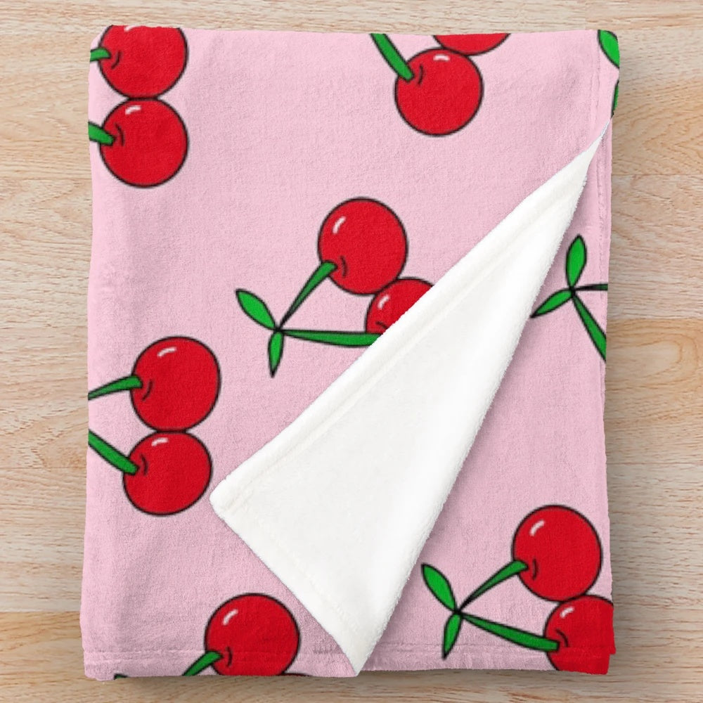 Colorful pop art inspired cherries pattern on a plush, cozy blanket