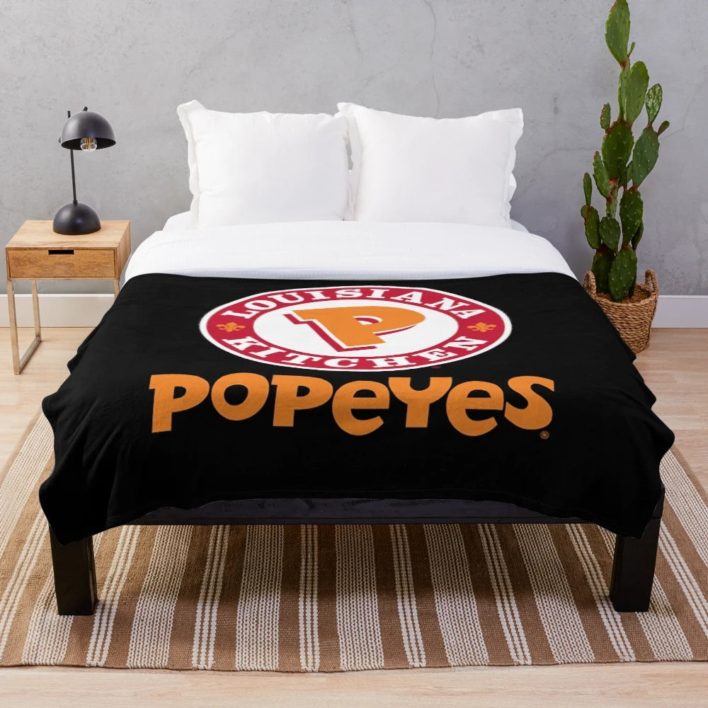 Popeyes logo plush blanket, offering a cozy and comfortable way to showcase your love for the popular fast-food brand.