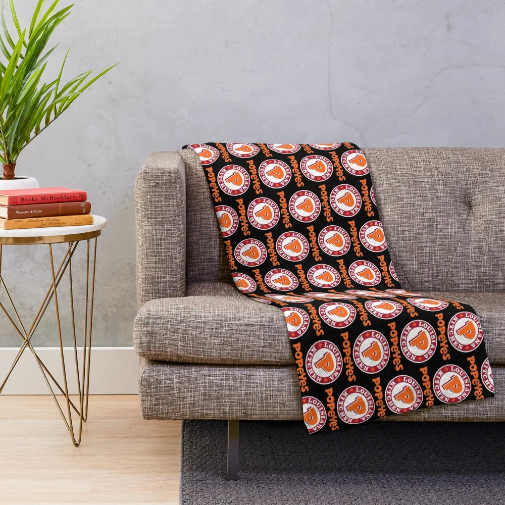 Popeyes-inspired plush blanket featuring the classic Popeyes logos and branding